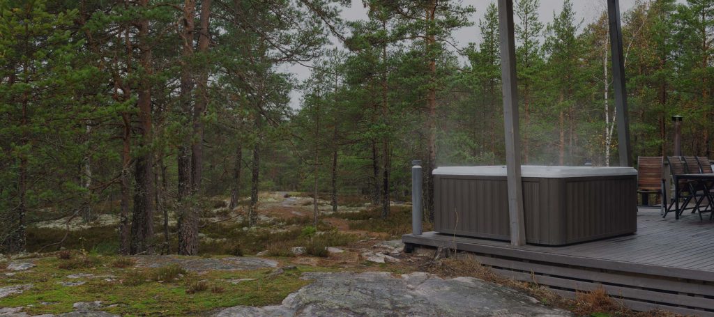 Original photo from The Fire Factory of an outdoor spa or hot tub with a forest nearby.